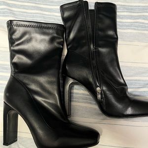 Trendy black faux leather boots worn once!